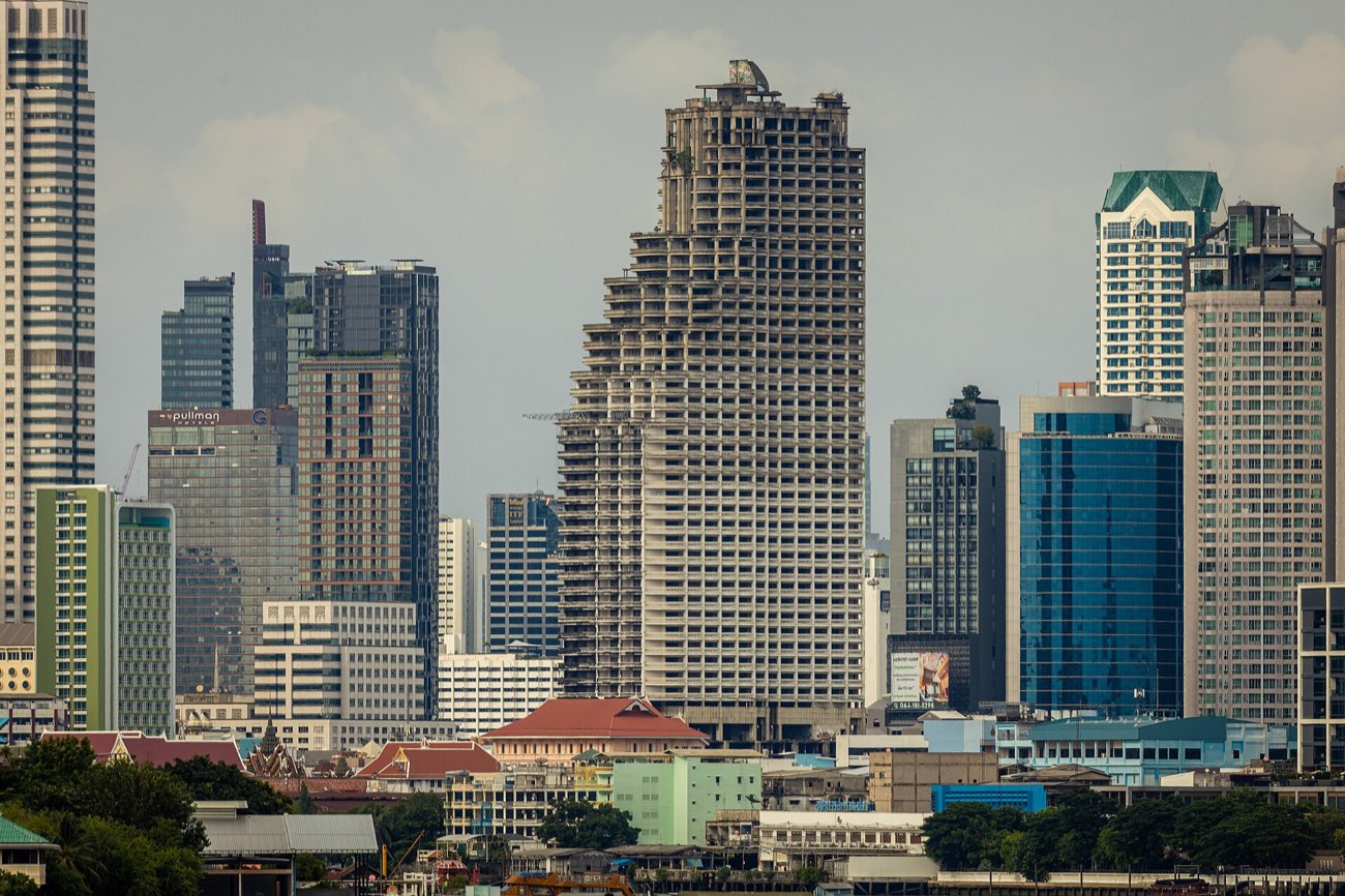 Lumpini Park's lake against the Silom-Sathorn skyline, Bangkok